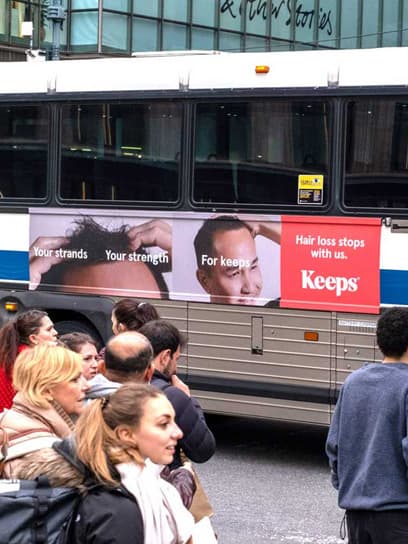 out of home advertising keeps bus